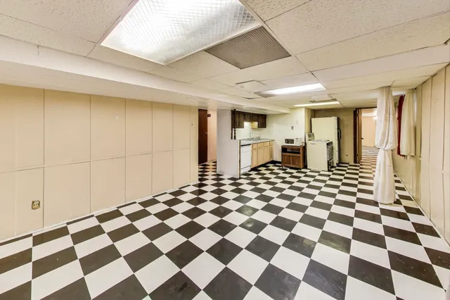 a living room with a black white checkered floor
