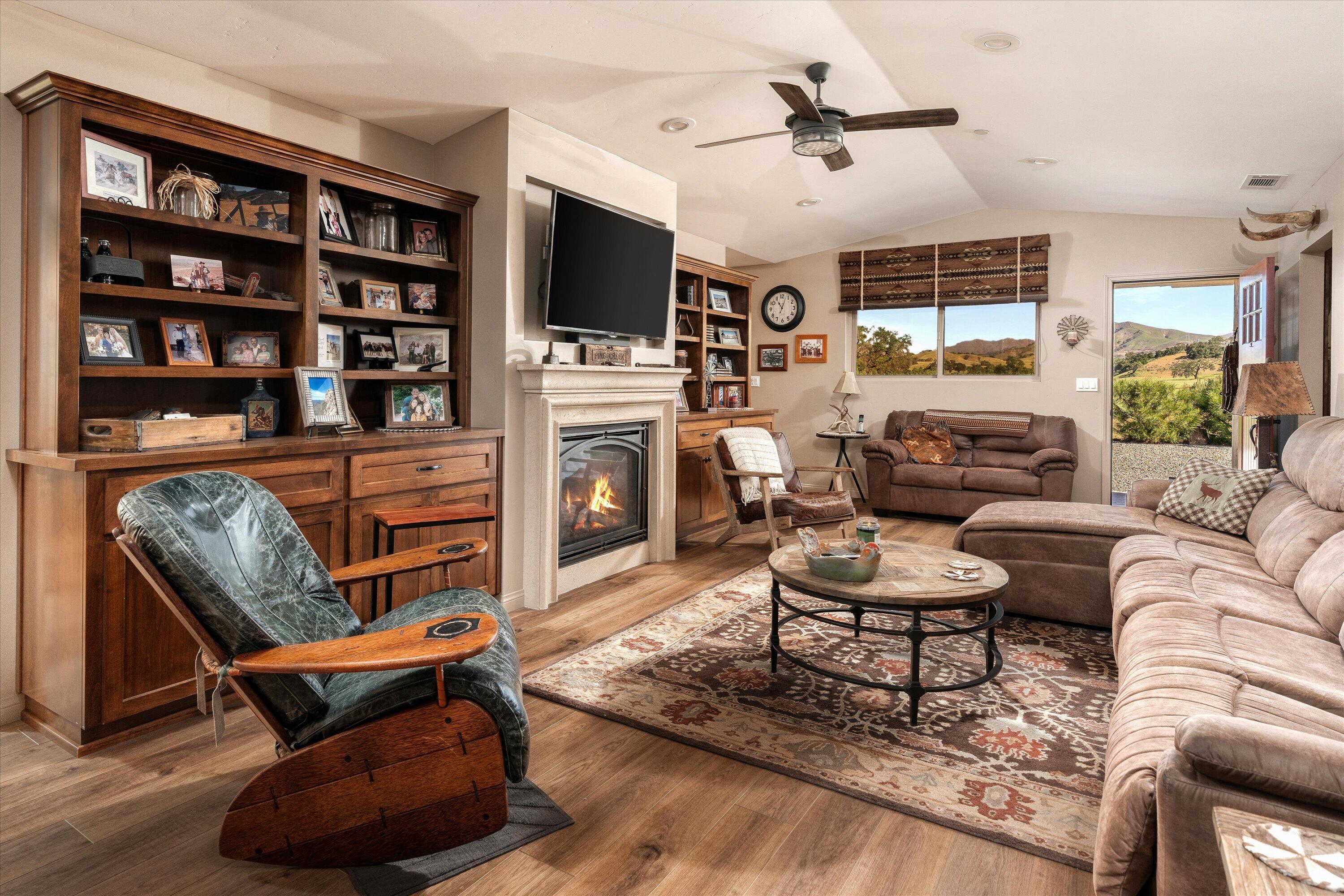 12707 Huasna Road Arroyo Grande, CA 93420 - Photo 35 of 77 a living room with furniture a rug and a flat screen tv