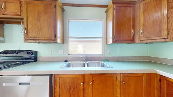 a kitchen with a sink and cabinets