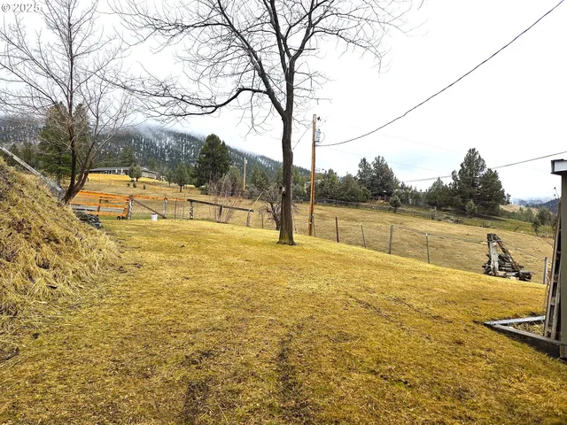 a view of a swimming pool with outdoor seating