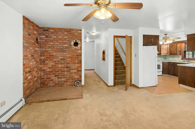 a kitchen with stainless steel appliances granite countertop a sink and a cabinets