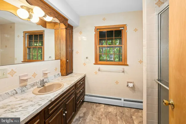 a view of a patio with table and chairs and potted plants