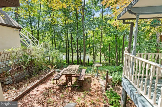 a view of front door and porch with wooden floor