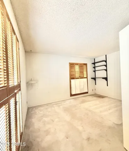 a bathroom with a granite countertop sink mirror and a bathtub