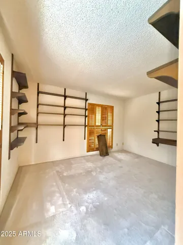 a view of a patio with chair and tables