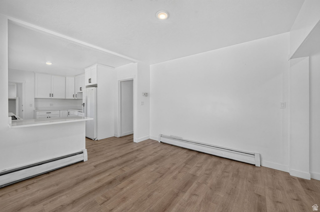 220 East Greenwood Avenue Midvale, UT 84047 - Photo 6 of 46 Open-concept living space with wood-finish flooring