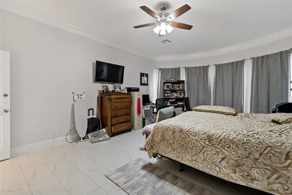 a bed room with a bed and a television