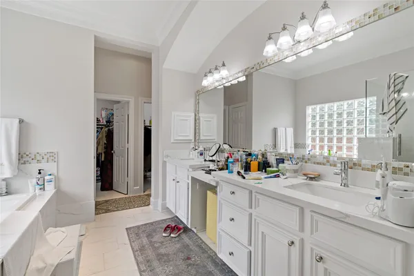 a bathroom with a double vanity sink mirror and double