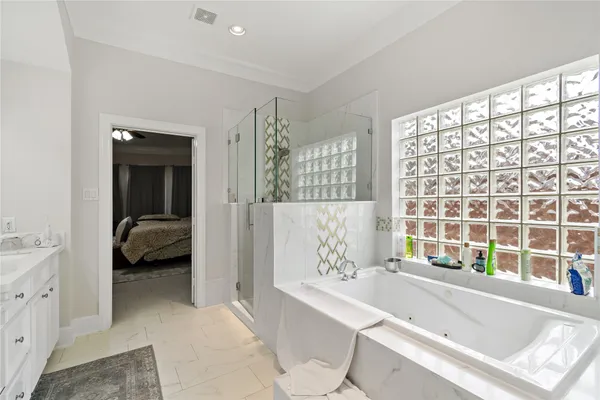 a en suite bathroom with a tub and shower