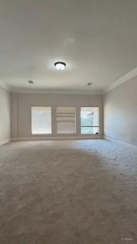 a view of empty room with windows