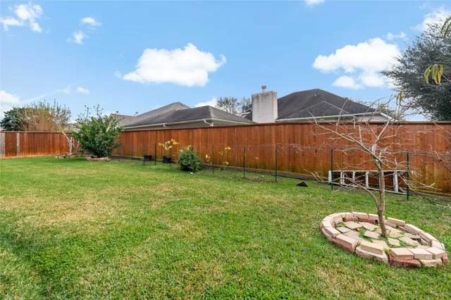 a view of a table and chairs in the garden