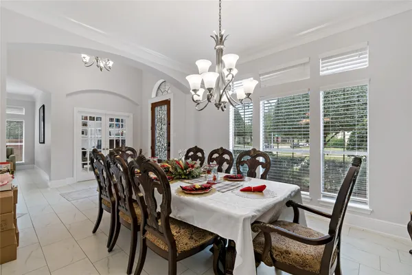 a view of a dining room with furniture and window