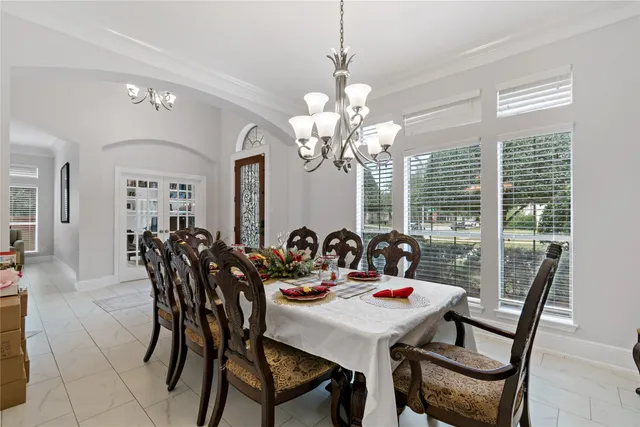 a view of a dining room with furniture and window