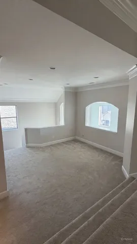 a view of an empty room and a window