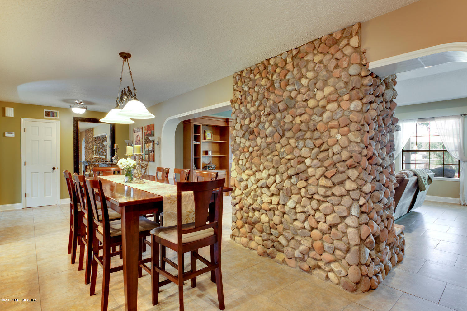 566 Bay Ridge Road Jacksonville, FL 32216 - Photo 10 of 46 dining room and stone fireplace