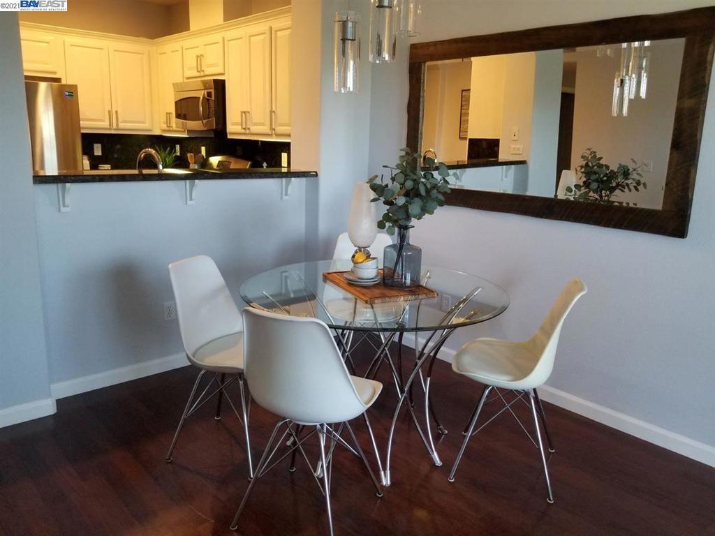 3360 Maguire Way Dublin, CA 94568 - Photo 3 of 18 a view of a dining room with furniture and wooden floor