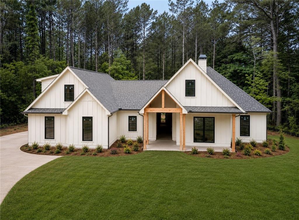 1698 Tibbitts Road Dallas, GA 30132 - Photo 1 of 16 a front view of house with yard and green space