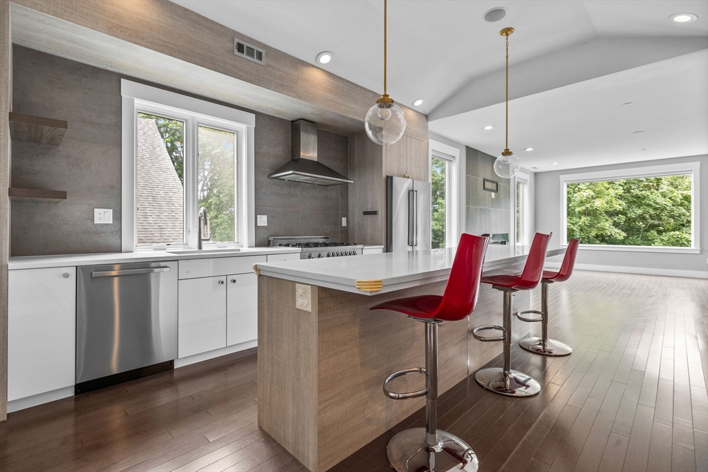 202 Rawson Road, Unit 3 Brookline, MA 02445 - Photo 3 of 17 a kitchen with a sink cabinets and wooden floor