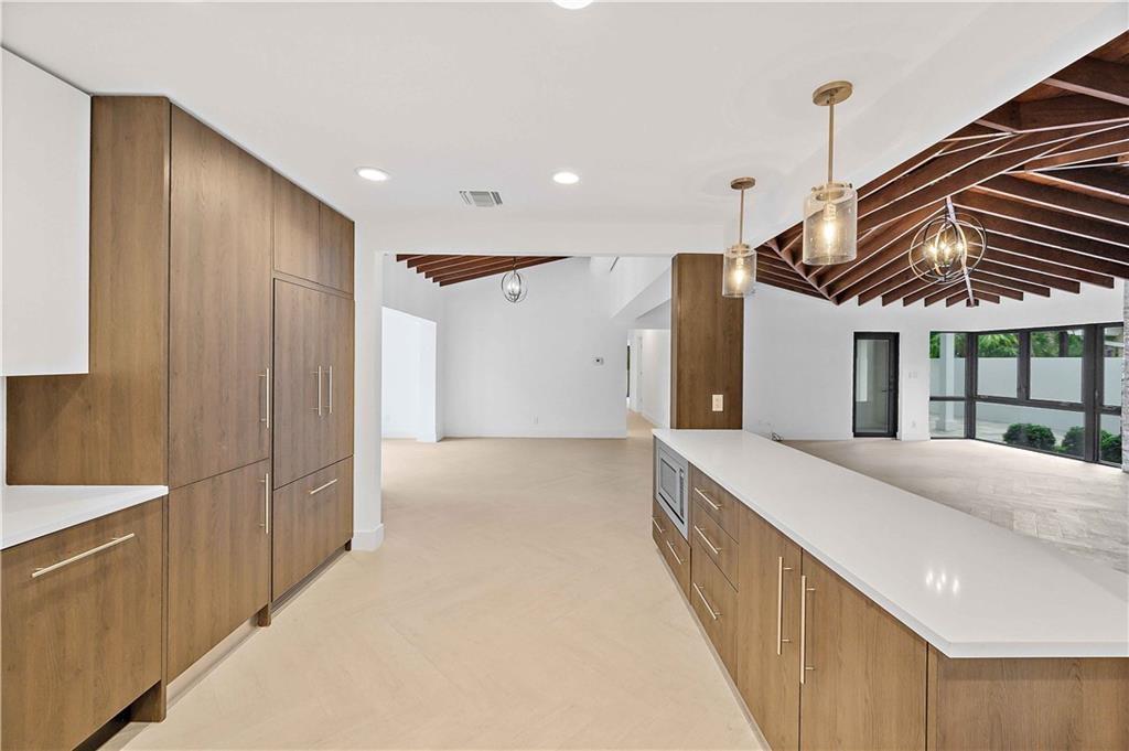 2201 Intracoastal Drive Fort Lauderdale, FL 33305 - Photo 13 of 35 a bathroom with a sink a mirror and a shower