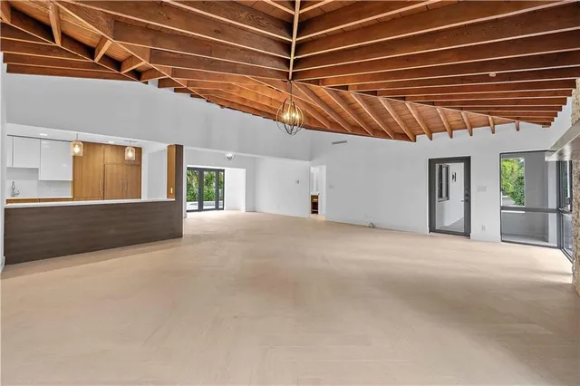 a view of a room with wooden walls