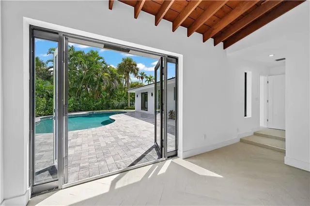 a bathroom with a double vanity sink and a large mirror