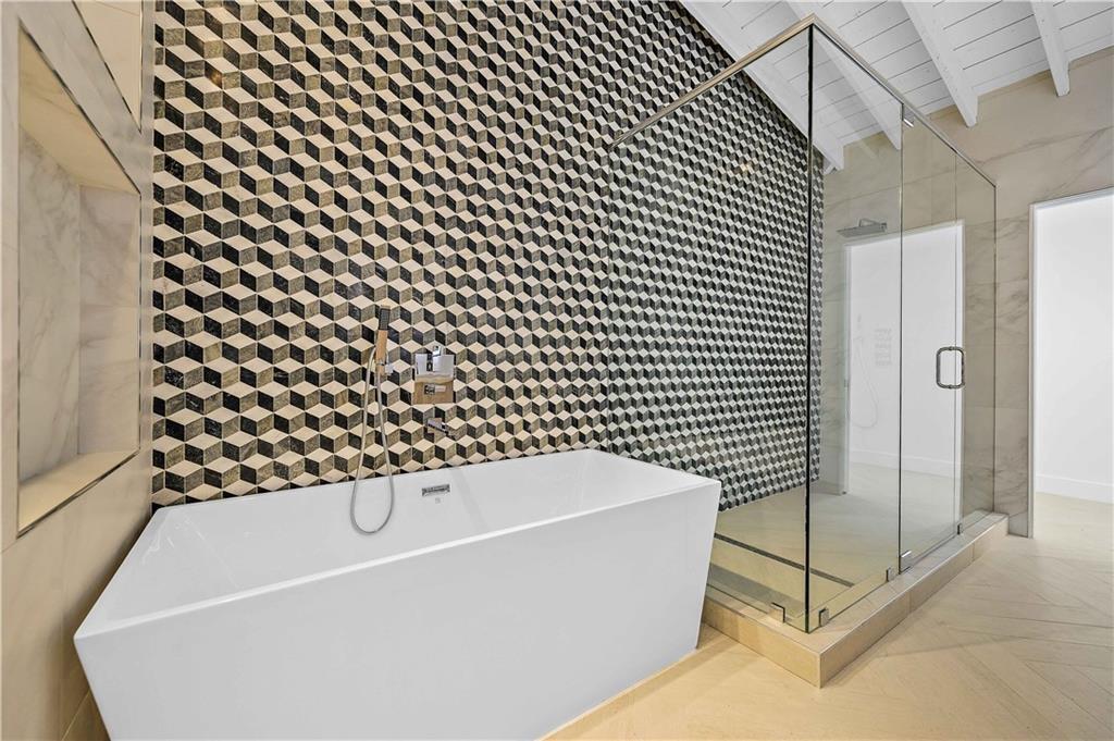 2201 Intracoastal Drive Fort Lauderdale, FL 33305 - Photo 19 of 35 a bathroom with a bathtub and shower