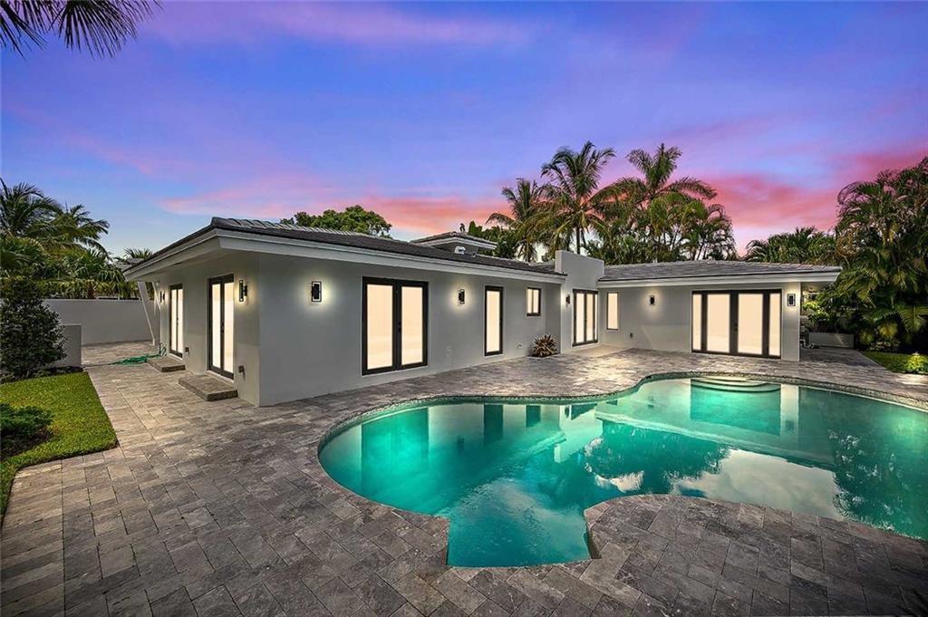 2201 Intracoastal Drive Fort Lauderdale, FL 33305 - Photo 2 of 35 a front view of a house with a yard