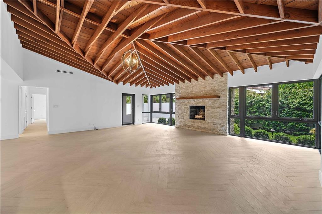 2201 Intracoastal Drive Fort Lauderdale, FL 33305 - Photo 9 of 35 a view of an empty room with a fireplace and a window