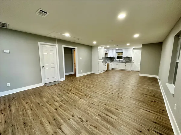 a view of a kitchen with a sink and cabinets