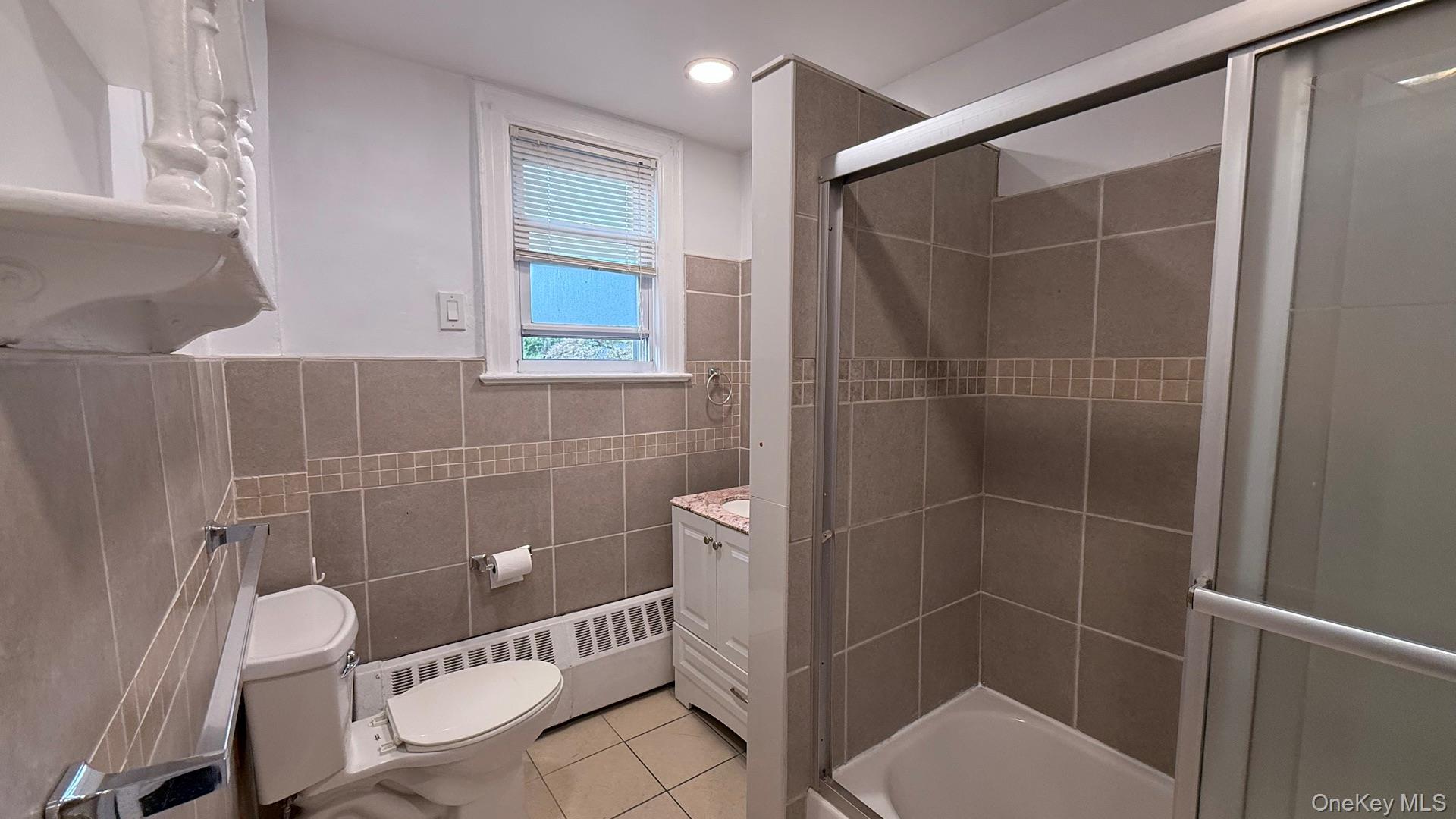 15 Prospect Street, Unit 2 Great Neck, NY 11021 - Photo 5 of 11 a bathroom with a toilet and a shower