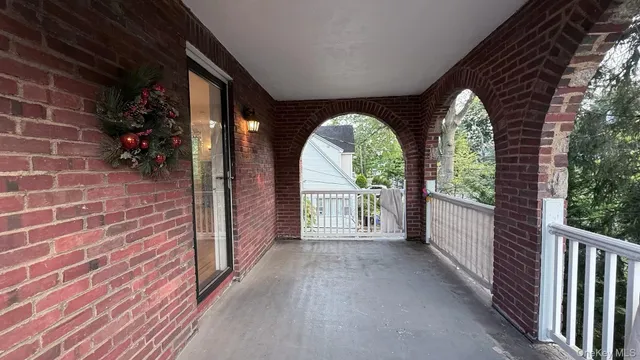 a view of a garden from a balcony