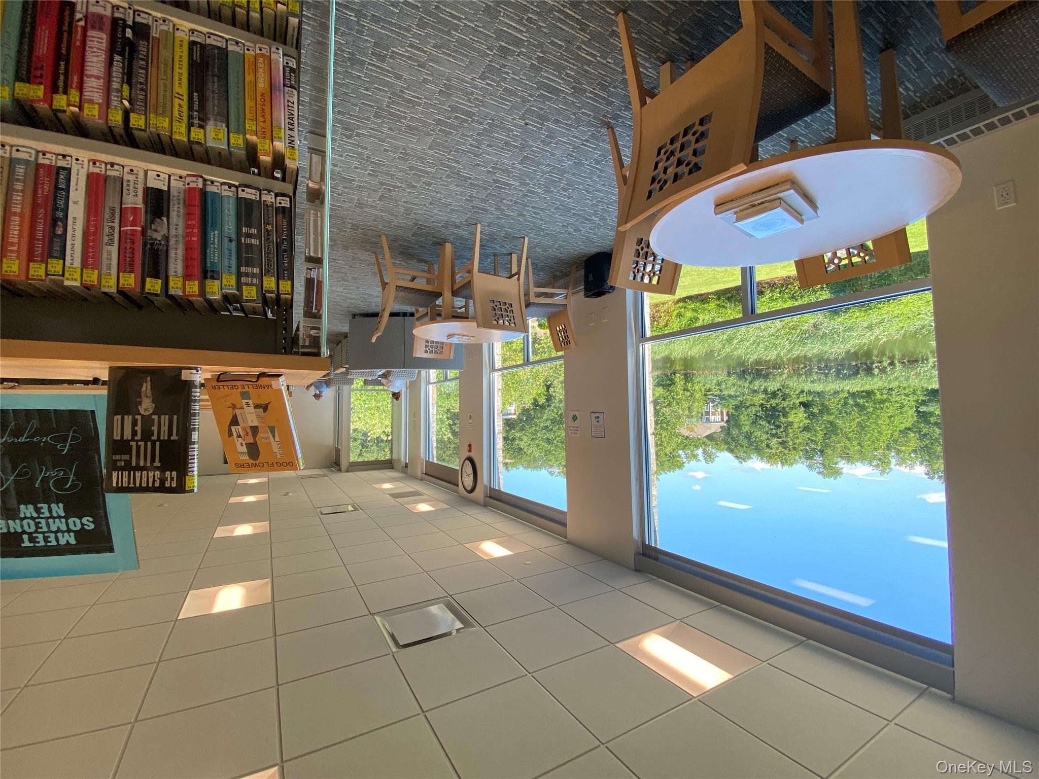 15 Prospect Street, Unit 2 Great Neck, NY 11021 - Photo 10 of 11 a view of a dining room with furniture window and outside view