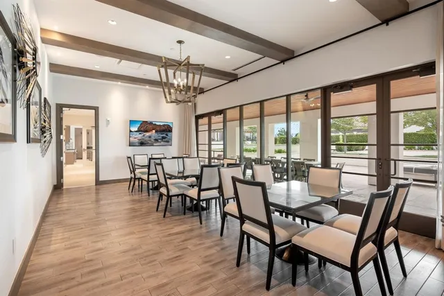 a large kitchen with kitchen island a sink table and chairs