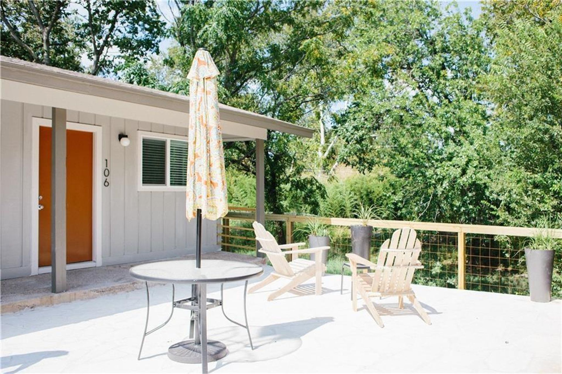 1302 East 52nd Street, Unit 101 Austin, TX 78723 - Photo 8 of 8 a view of a patio with a table and chairs