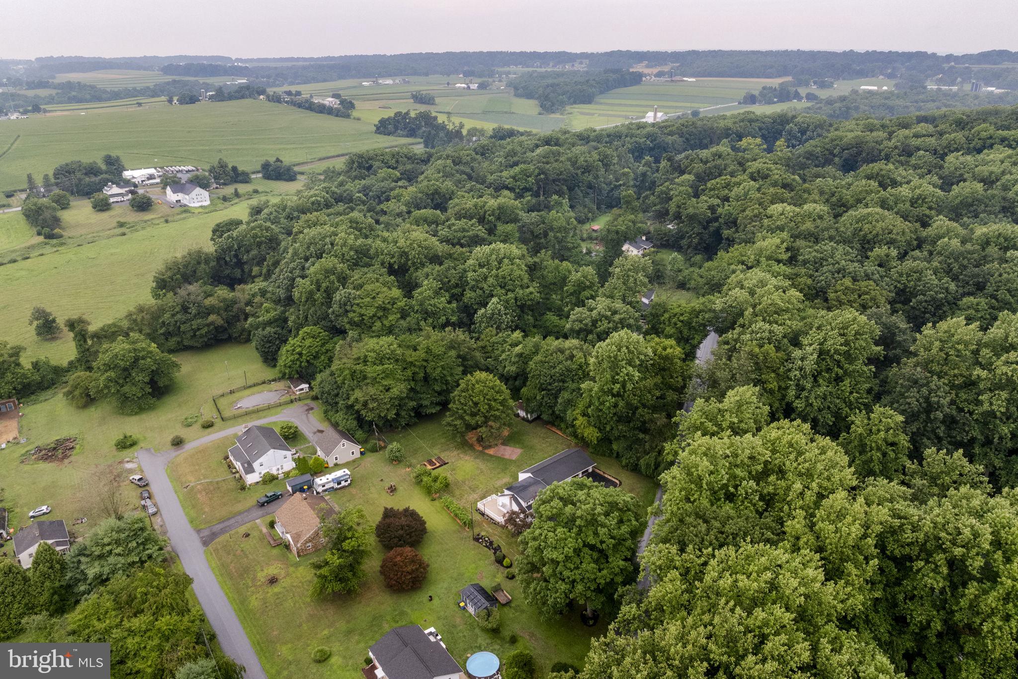 65 Compass Road Parkesburg, PA 19365 - Photo 24 of 61 Serene homes nestled in lush greenery.