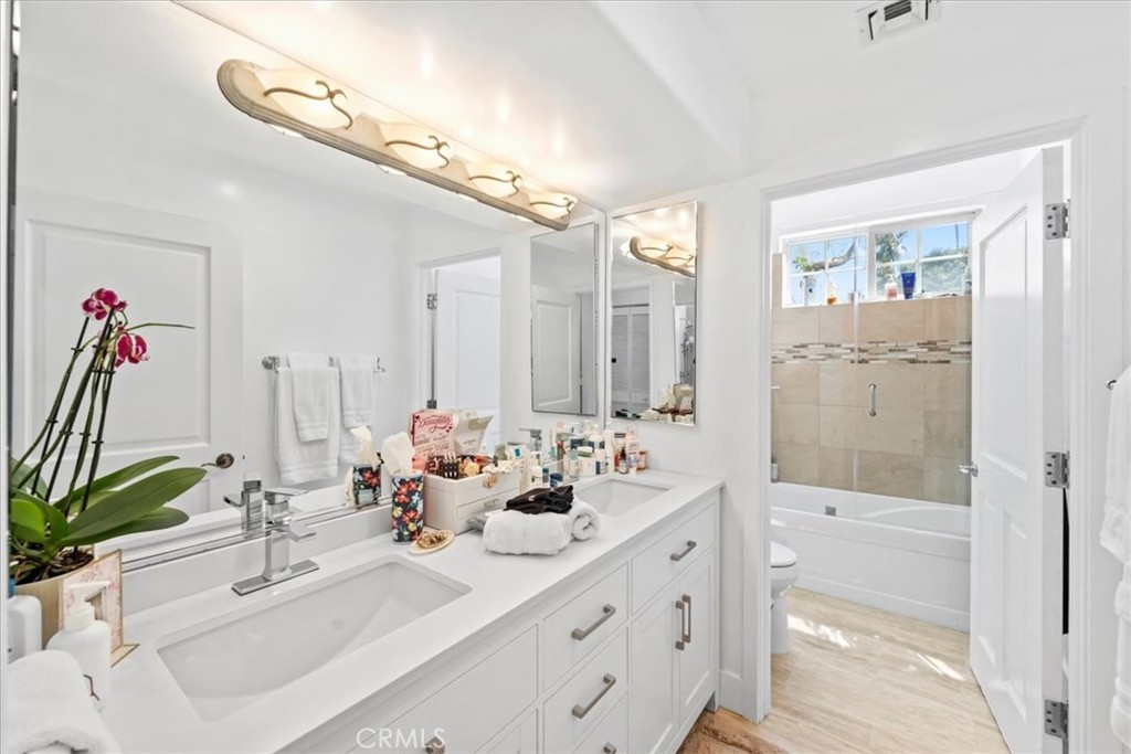 1020 Harbor Crossing Lane Marina del Rey, CA 90292 - Photo 32 of 54 a bathroom with a double vanity sink mirror and shower