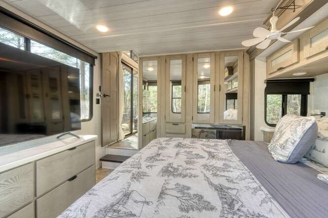 47 Conestoga Trail Murphy, NC 28906 - Photo 19 of 42 a spacious bedroom with a large bed and walk in closet