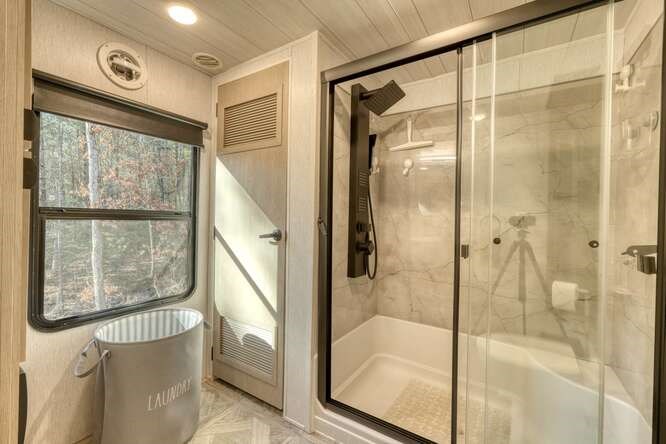 47 Conestoga Trail Murphy, NC 28906 - Photo 20 of 42 a bathroom with a glass shower door and a window