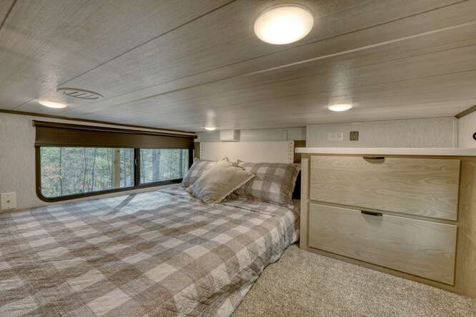 47 Conestoga Trail Murphy, NC 28906 - Photo 22 of 42 a large bed sitting in a room next to a window
