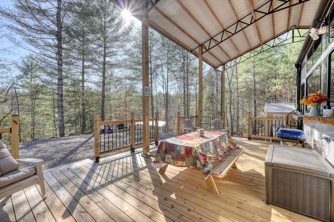 47 Conestoga Trail Murphy, NC 28906 - Photo 29 of 42 a outdoor space with lots of tables a large mirror and a couch