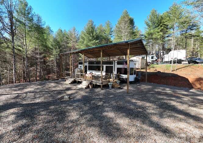 47 Conestoga Trail Murphy, NC 28906 - Photo 30 of 42 a view of a patio with table and chairs under an umbrella