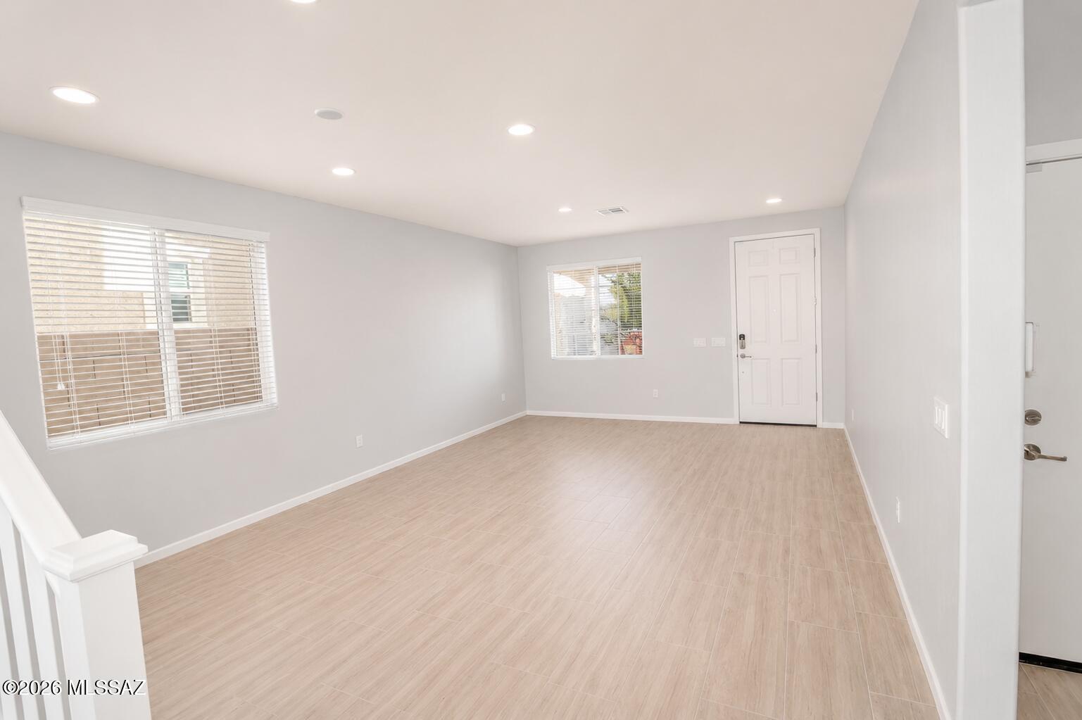 11484 East Desert Raptor Loop Tucson, AZ 85747 - Photo 25 of 28 an empty room with windows