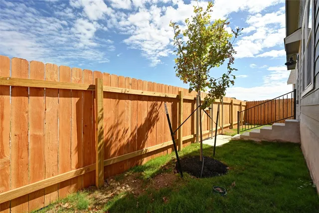 a backyard of a house with lots of green space