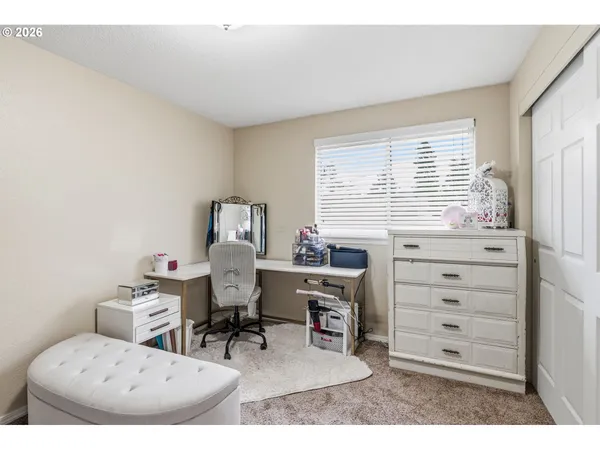 a workspace with furniture and a window