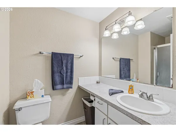 a bathroom with a sink a vanity and a mirror