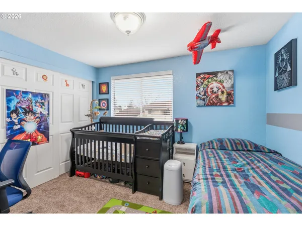 a bedroom with furniture and a bed