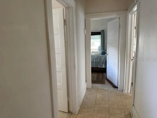 a view of a hallway and closet