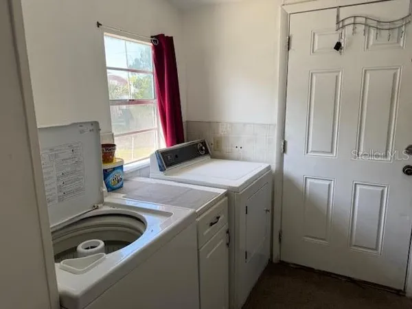 a bathroom with a sink and a washing machine