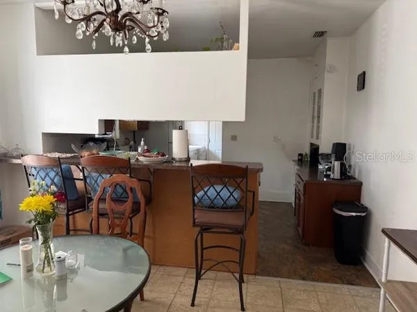 a living room with furniture and a lamp