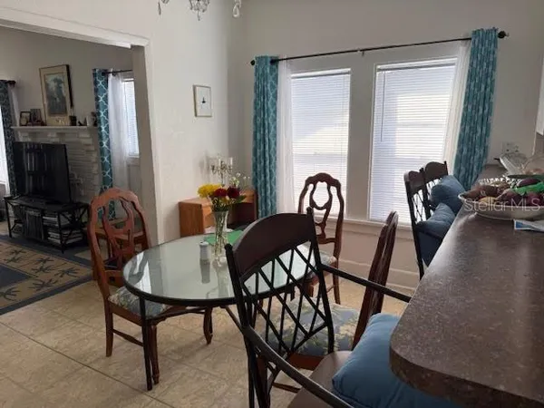 a view of a dining room with furniture and a window